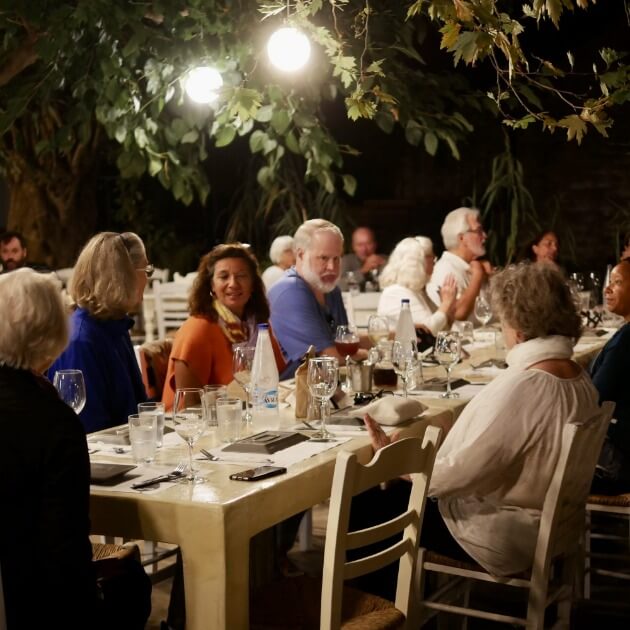 Load image into Gallery viewer, Diane Kochilas savoring a delightful dinner in the company of a small group of fellow travelers Dolomites with Bruno Pisani &amp; Luka Vunduk - Culinary and Wellness - JOURNEY - Zhoola
