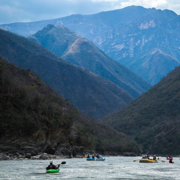 A group of people kayaking down a river - Kingdom of clouds with Luigi Marmanillo - Rafting & camping - EXPEDITION