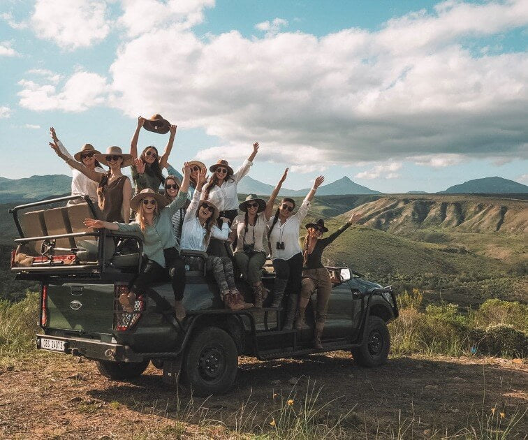 Load image into Gallery viewer, Joyful and smiling women enjoying a jeep ride at Gondwana Safari Lodge - From the Beach to the Bush with Kiersten &amp; Caity - VendorSafari &amp; Exploration (Women only) - JOURNEY - Zhoola
