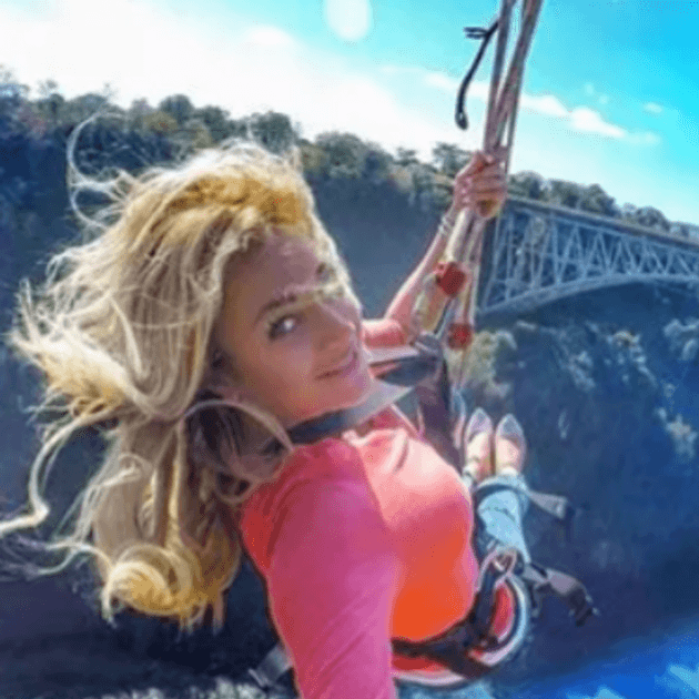 Girl taking selfie on Swing - Safari & Waterfalls in Africa with Alyssa Ramos - Safari & Culture (women only) - JOURNEY