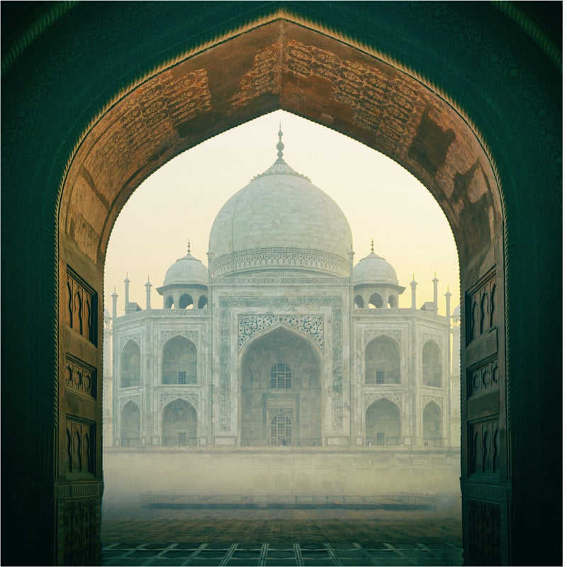 Load image into Gallery viewer, The magnificent Taj Mahal, a symbol of eternal love, glowing under the golden rays of the sun in Agra, India.Signature India with Sandhya Balakrishnan - Yoga &amp; Exploration - Journey - Zhoola
