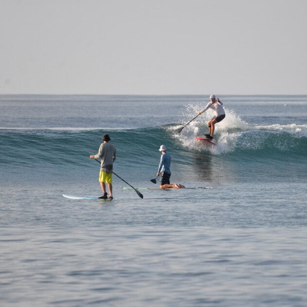 Load image into Gallery viewer, A group of men enjoying Stand Up Paddleboarding (SUP) on calm waters - Maldives SUP surf trip with Tiago Silva - Live Aboard Surfing - Zhoola
