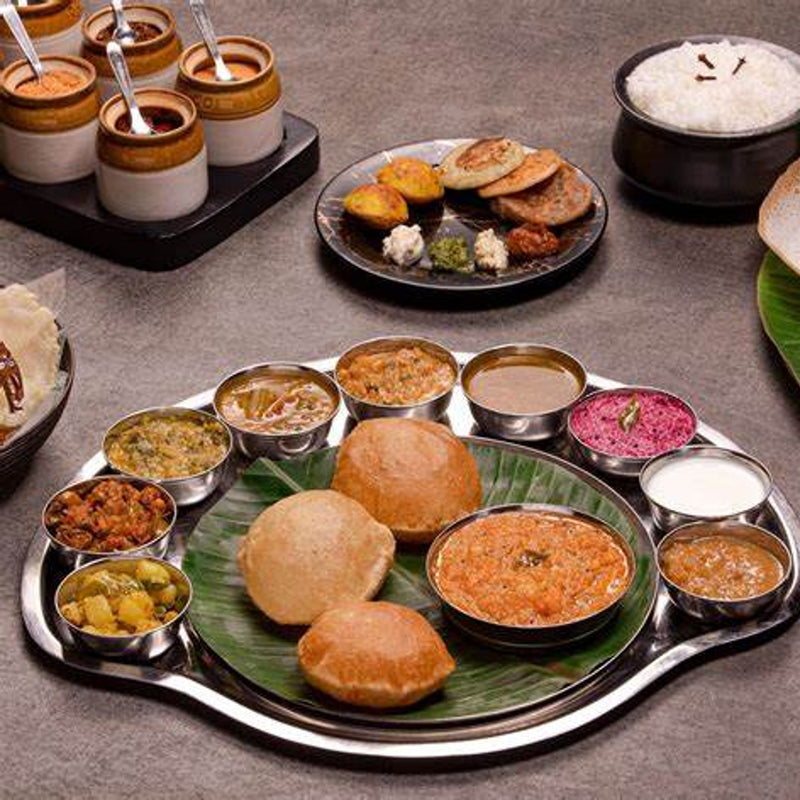 Load image into Gallery viewer, An authentic Rajasthani thali, a traditional Indian meal consisting of various delicious dishes from the Rajasthan regionTailor-made India with Sandhya Balakrishnan - VendorYoga &amp; Nature - JOURNEY - Zhoola

