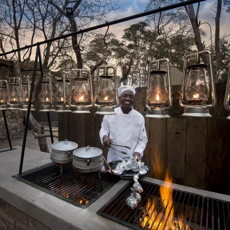 Load image into Gallery viewer, Alfresco Barbecue Hosted by a Young Woman in Africa - Safari in the Okavango Delta in Botswana with Sebastian &amp; Lin-1 -VendorSafari &amp; Nature - EXPEDITION - Zhoola
